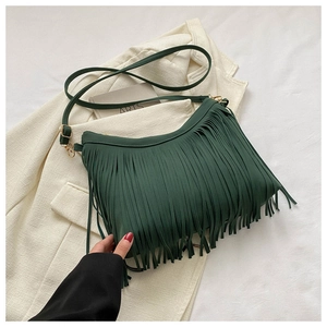 Detail of dark green tassel crossbody bag with matte faux leather fringe and metal buckle