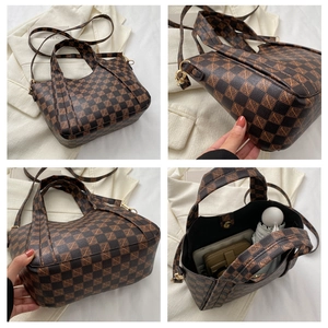 Close-up of the spacious interior of a brown checkered tote bag showing ample storage