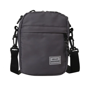 Lightweight dark grey shoulder bag with Hello Weekend label and adjustable strap