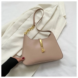 Detailed macro view of the light brown PU leather shoulder bag with gold metal clasp