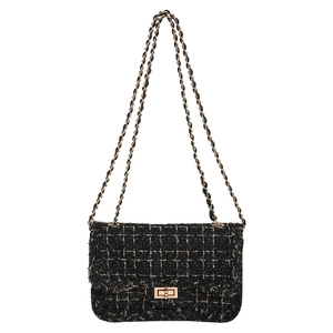 Sac bandoulière en tweed noir et doré avec fermoir rotatif et bandoulière chaîne