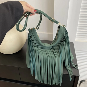 Retro dark green tassel bucket bag with gold hardware and adjustable strap for women