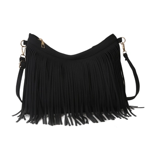 Large black fringe tote bag with gold hardware and adjustable crossbody strap