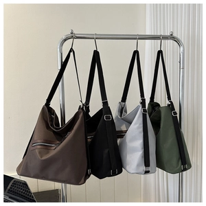 Detail view of large canvas tote bags in four colors with adjustable shoulder straps