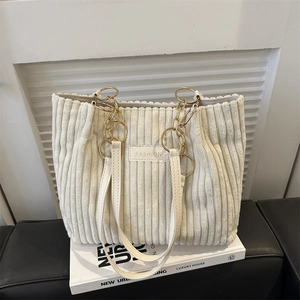 White corduroy tote bag with gold chain and leather handles for women's daily commute