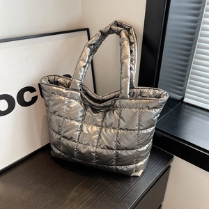 Silver metallic quilted tote bag with a modern glossy finish and large capacity