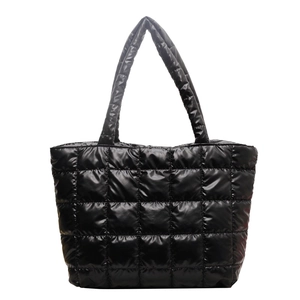 Large black quilted tote bag with shiny puffer finish and padded handles for daily commute