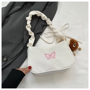 Sac à bandoulière blanc avec broderie papillon rose et bandoulière à volants
