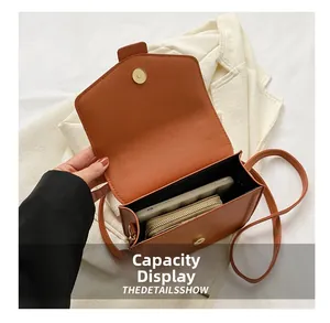 Internal view of brown pebble leather bag showing storage space for phone and wallet