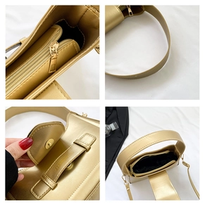 Detail view of champagne gold underarm bag with magnetic closure and inner zipper pocket