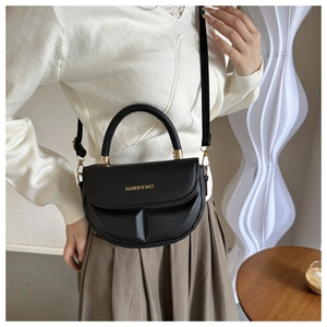 Chic black semi-circular crossbody bag with adjustable strap and golden logo detail