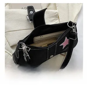 Top view of black canvas crossbody bag showing internal capacity for phone and wallet