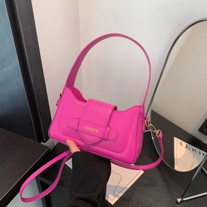 Neon pink faux leather underarm bag with decorative buckle and detachable strap