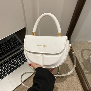 Minimalist white semi-circle shoulder bag with gold lettering and adjustable strap