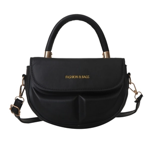 Minimalist black crescent shoulder bag with golden hardware and adjustable crossbody strap