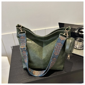 Deep green leather hobo bag with ethnic embroidered strap and small coin purse