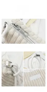 Detail view of corduroy texture, braided leather handle and silver metal hardware on beige bag