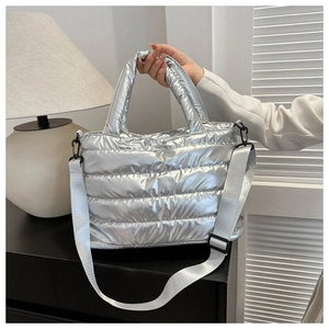 Silver quilted puffer handbag with metallic finish and adjustable strap for women