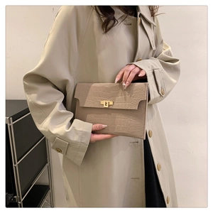 Minimalist beige felt envelope clutch bag with crocodile texture and gold metal buckle