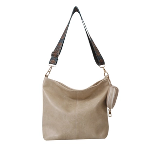 Beige faux leather crossbody bag with ethnic print strap and round coin purse accessory