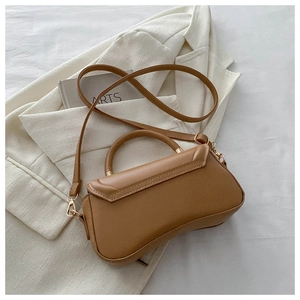 Detail view of camel PU leather bag with stitching, gold hardware and detachable strap