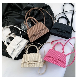 Five assorted mini woven hourglass handbags in pink, white, beige, brown, and black