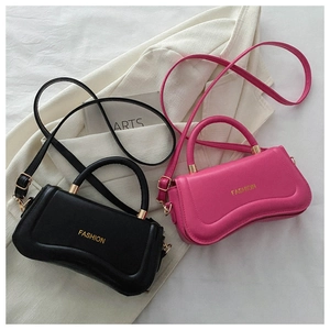 Detailed top view of black and magenta PU leather handbags with golden fashion lettering