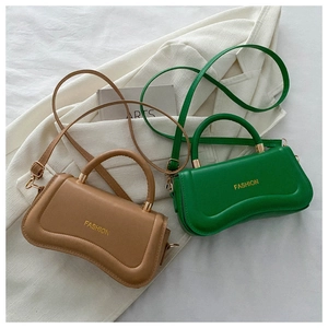 Detail showing high-quality PU leather stitching and golden fashion text on mini handbags