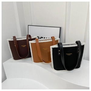 Chic women's shoulder bag with fuzzy shearling trim and leather straps in three colors