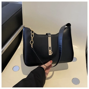 Chic black minimalist shoulder bag with gold chain and metal lock for women