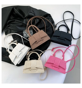 Detailed collection of woven texture handbags in multiple colors with ring buckle hardware