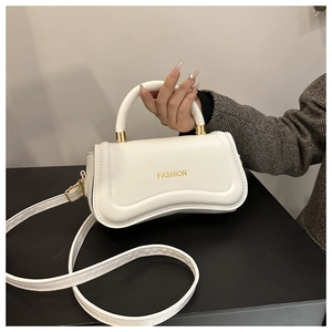 Minimalist white PU leather handbag with golden FASHION print and top handle for women