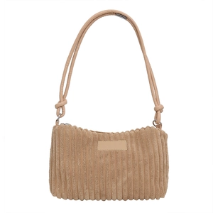 Minimalist beige corduroy hobo shoulder bag with knot strap detail on white background