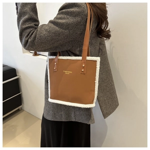 Brown PU tote bag with white faux fur trim and long shoulder straps for winter style