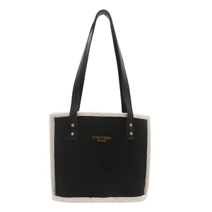 Chic black matte plush tote bag with white faux shearling trim and gold stud details