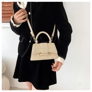 Minimalist beige woven straw crossbody bag with circular metal buckle for summer
