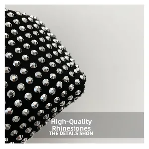 Macro shot of premium rhinestones on black fabric for a sparkly fashion handbag