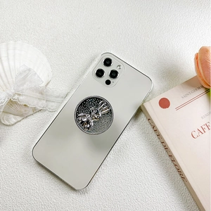 Silver electroplated rabbit phone socket grip holder with crystal decor on white smartphone