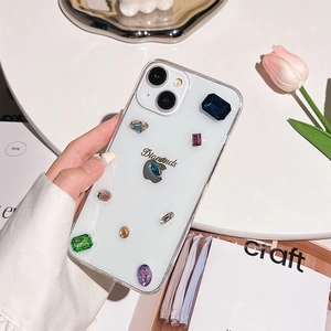 Detail view of transparent iPhone case with colorful rhinestones and Diamonds lettering