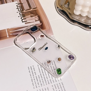 Detailed shot of transparent iPhone case with colorful luxury gemstones and J.Diamonds logo