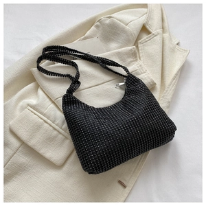 Detailed close-up of a black rhinestone hobo bag featuring sparkling crystals and silver zipper