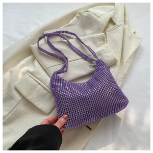 Close-up of purple rhinestone hobo bag with sparkling crystals and metal zipper detail