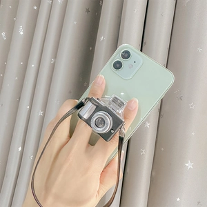 Vintage camera style phone socket grip with mini leather strap on smartphone