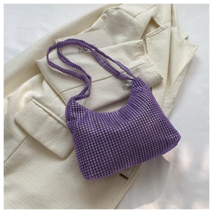 Close-up of a purple rhinestone underarm bag with shimmering crystal details and strap