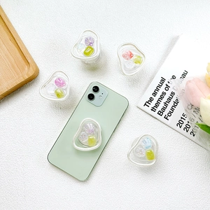 Support de téléphone floral en résine avec fleurs colorées sur socle transparent