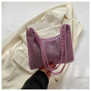 Close-up of luxury pink rhinestone handbag with dual handles and grid crystal texture