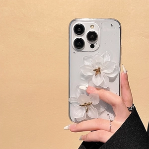 Close-up of 3D white floral design with silver foil on iPhone Pro series case