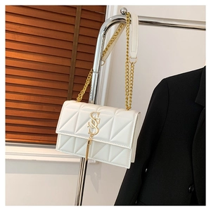 Elegant white quilted chain shoulder bag with gold hardware and tassel detail