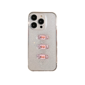 Glitter iPhone 16 Pro Max case with pink candy charms and silver heart sparkles