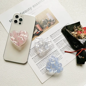 3D heart phone socket grip with colorful button filling on a white smartphone